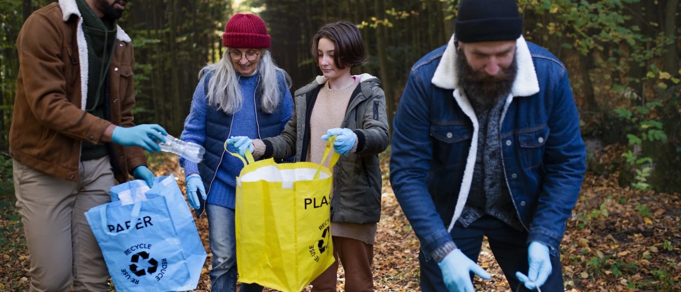 diverse-group-of-volunteers-cleaning-up-forest-from-waste-community-service-concept.jpg